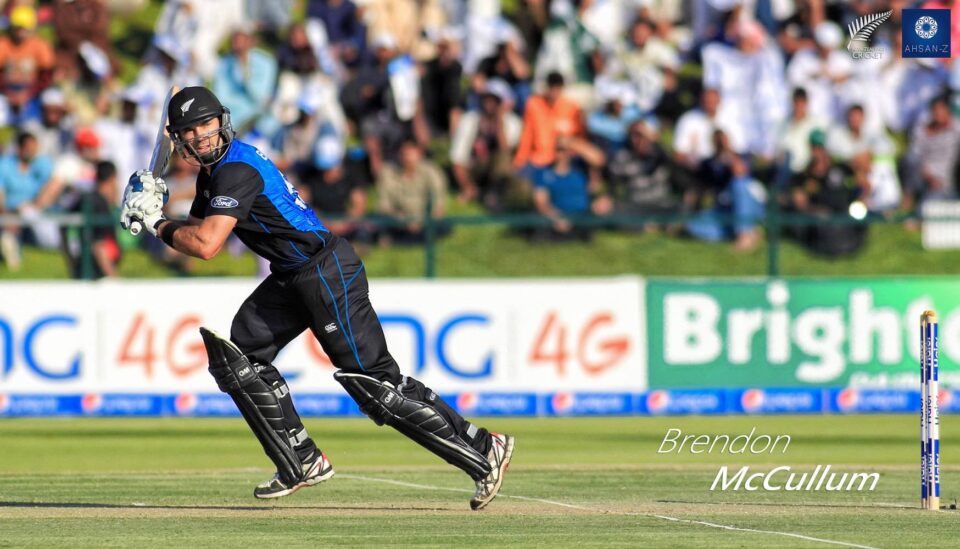 Brendon McCullum, a New Zealand cricketer, batting in action during a match, wearing black and blue kit.