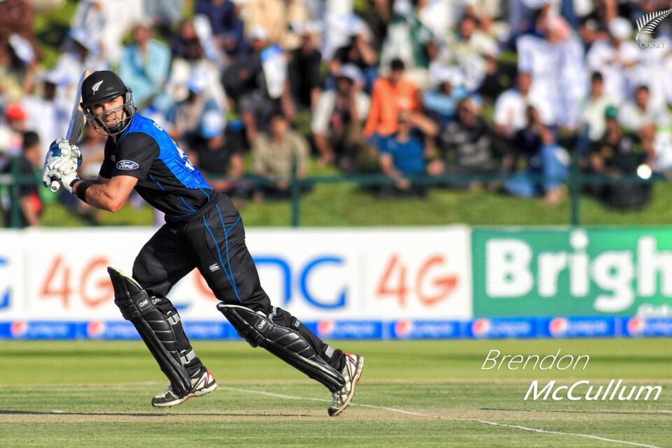 Brendon McCullum, a New Zealand cricketer, batting in action during a match, wearing black and blue kit.
