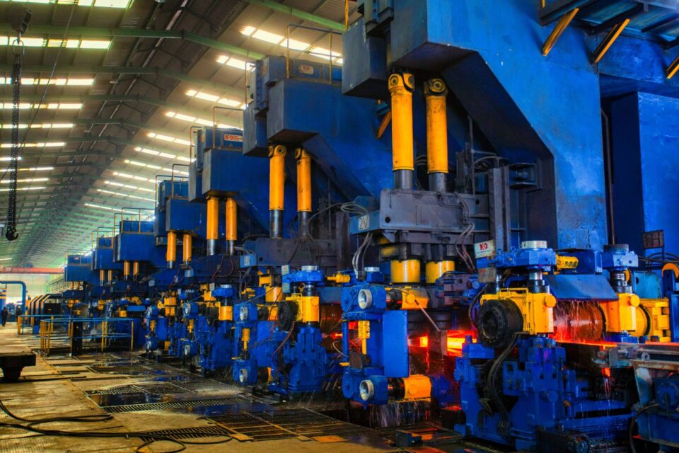 Molten steel being poured into a mold in a steel mill