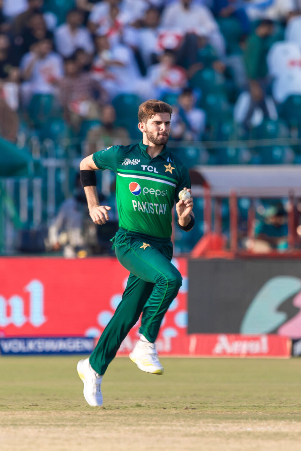 Pakistani fast bowler Shaheen Afridi runs in to deliver a ball during an Asia Cup match.